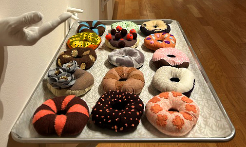 Eunkang Koh, Doughnut Dreams, screen printing, sewing, aluminum tray, plaster of Paris, 3" x 24" x 18", $10,000